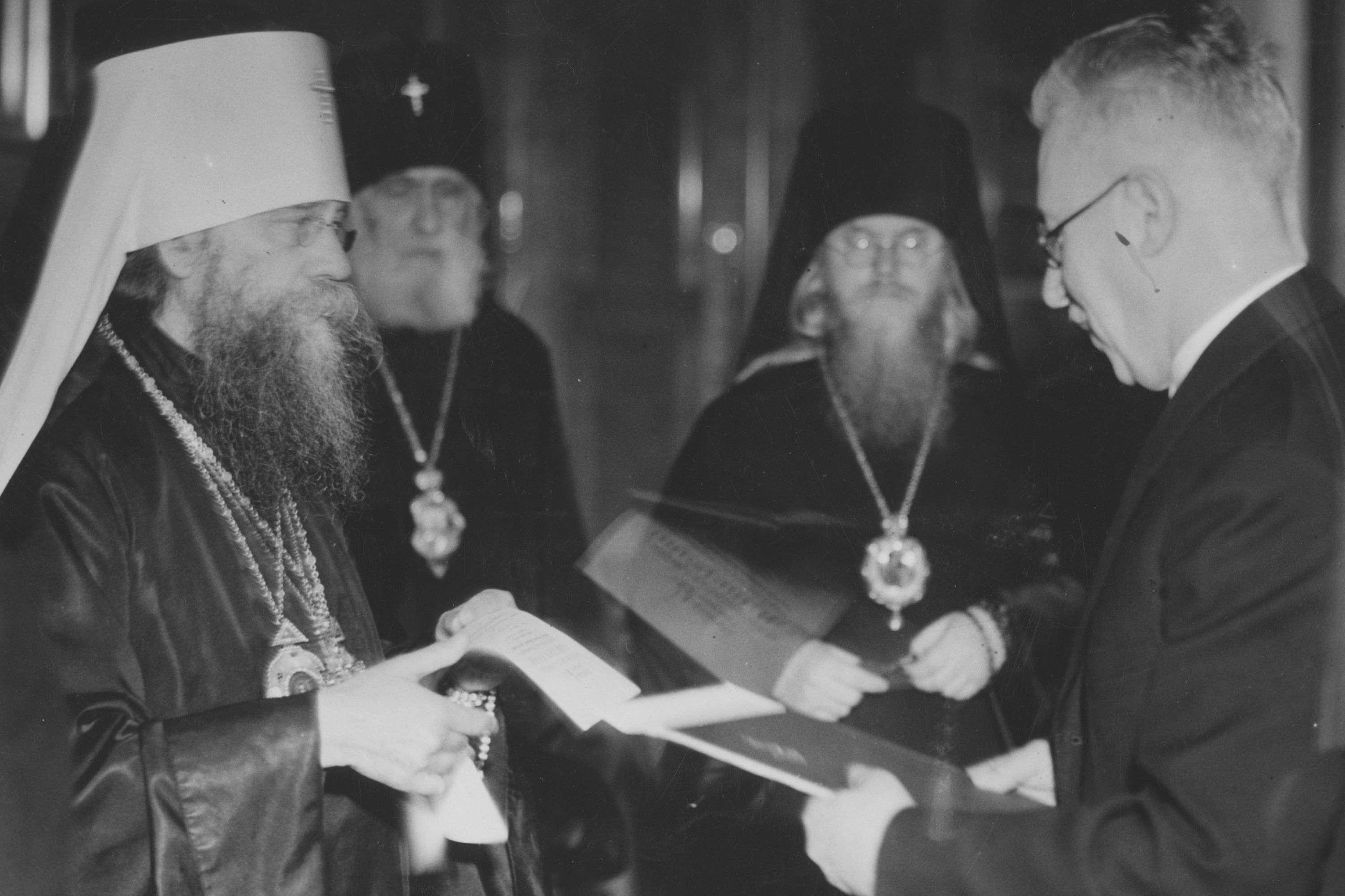 Warsaw, 1938: Metropolitan Dionysius Waledynski, together with Archbishop Theodosius Feodosiyev of Vilnius (background left) and Archbishop Alexius Gromadsky of Grodno (background right), hand over the internal statutes of the PAOC to the Polish Minister of Religious Affairs and Education, Professor Wojciech Swietoslawski. After the autocephaly was proclaimed in 1925, the most important act in relations with the Polish state was the decree of President Ignacy Moscicki of 18th November 1938, which granted full legal regulation to the PAOC. - фото 132318